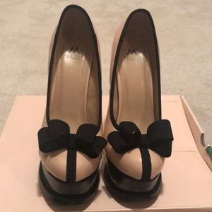 Nude and black bow platform heels